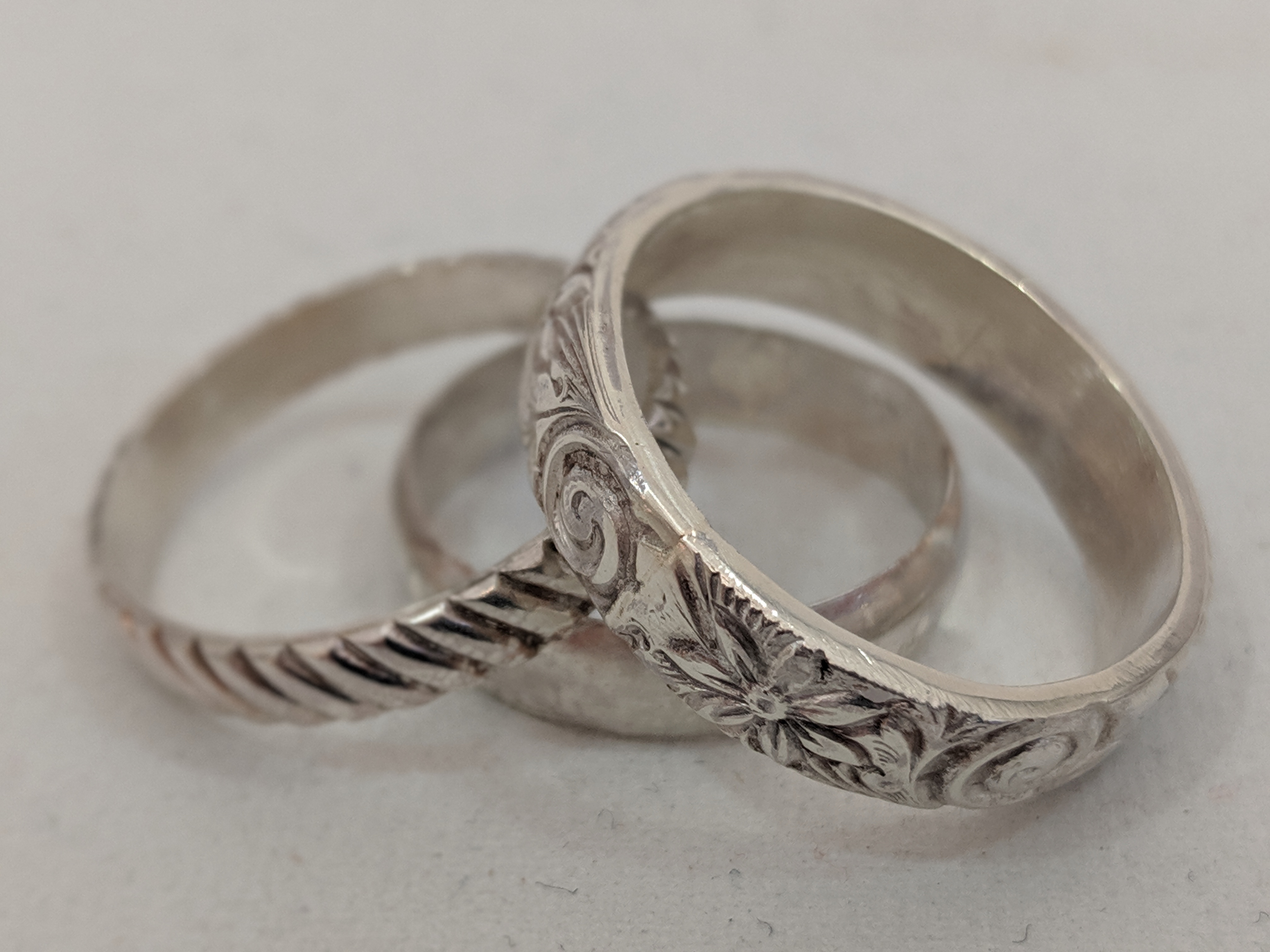 Three silver rings