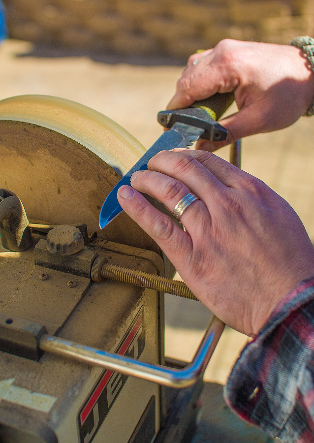 Image of Man Sharpening Knife